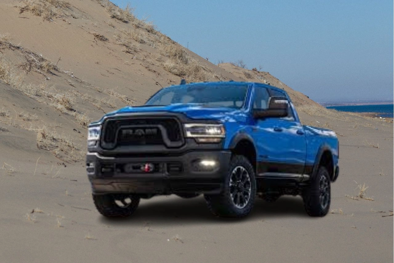 Blue RAM 2500 HD Rebel off-road pickup truck in desert terrain showcasing ultimate off-road beast capabilities