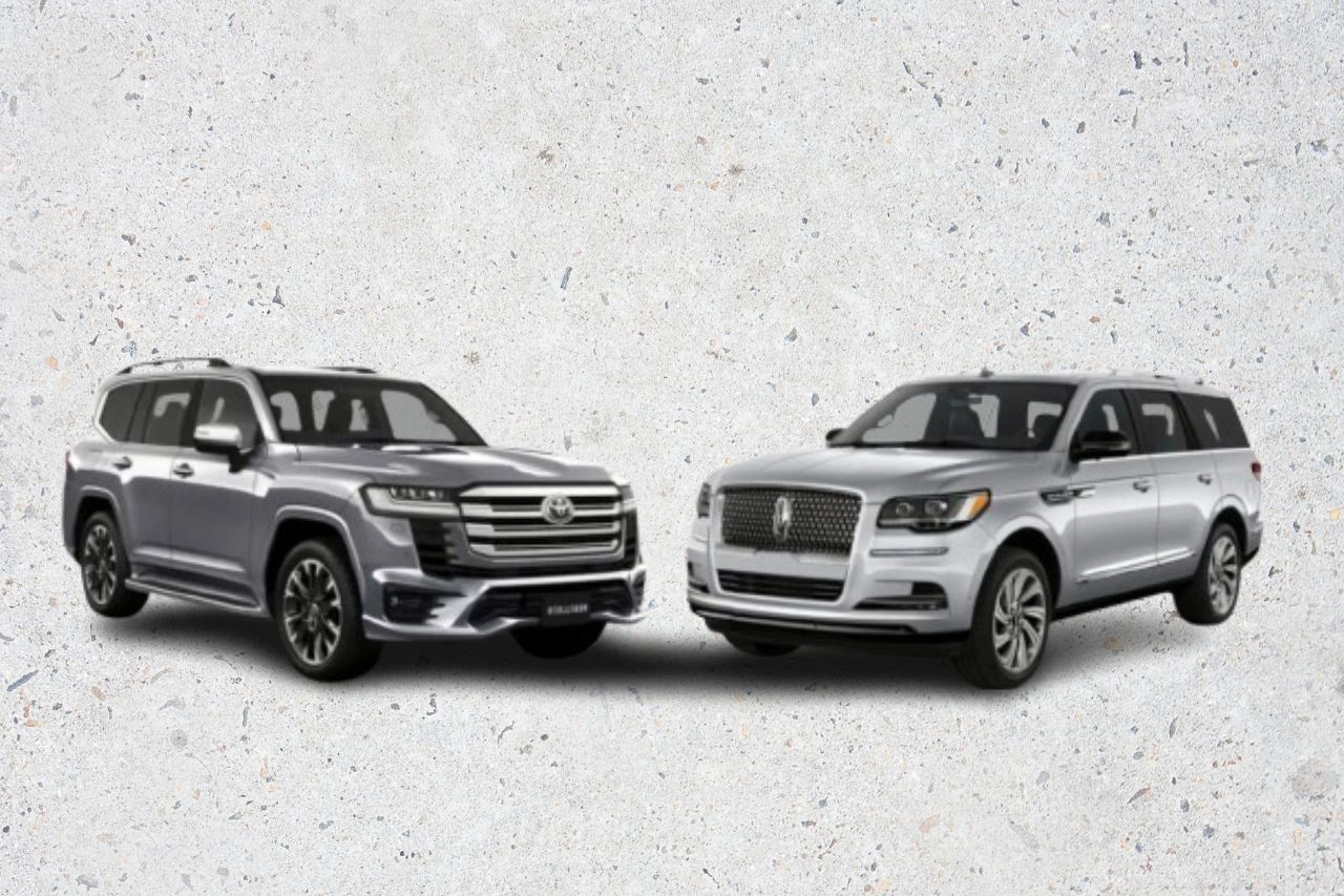 Side-by-side comparison of silver Lincoln Navigator XL and white Toyota Land Cruiser 300 luxury SUVs